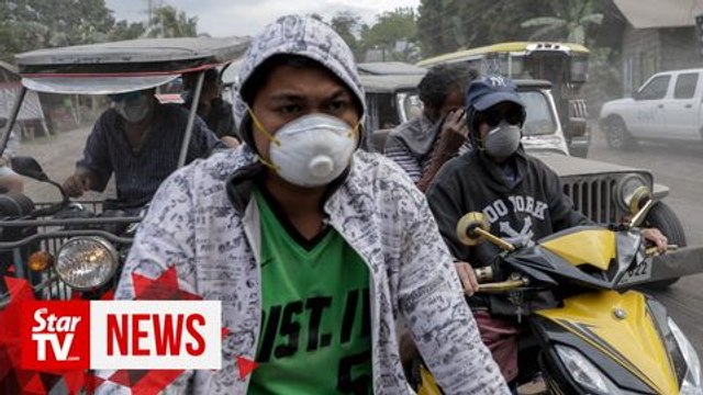 Philippine residents retrieve animals, belongings amid threat of volcano eruption