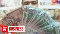 Ringgit gains ground