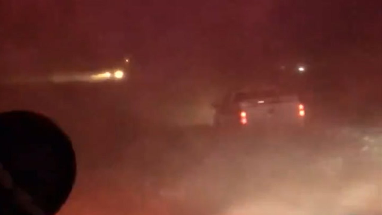 Vehicle stranded in midst of chaotic, blizzardlike conditions