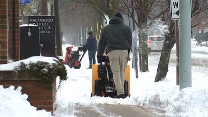 Snow cleanup commences in Michigan