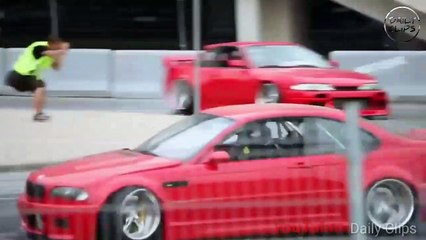 Cars drifting in front of crowd