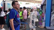 Japanese inventor shows off dancing skeleton suit at Thai tech convention