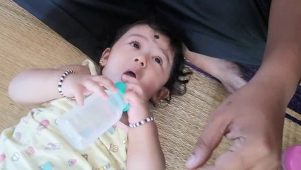 5 months baby drinking water  without anyone's help