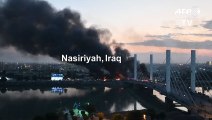 Black smoke rises from burning tyres blocking a bridge in Iraq's Nasiriyah