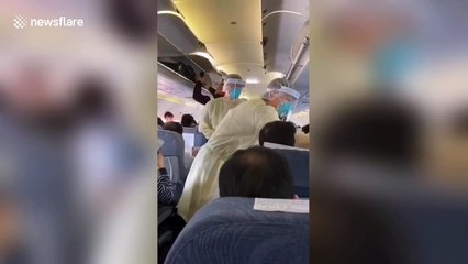 Medics on Air China plane check passengers' temperatures in bid to contain new virus