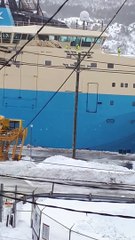 Shoveling snow off a ship