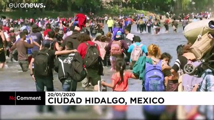 Migrants cross river from Guatemala to Mexico