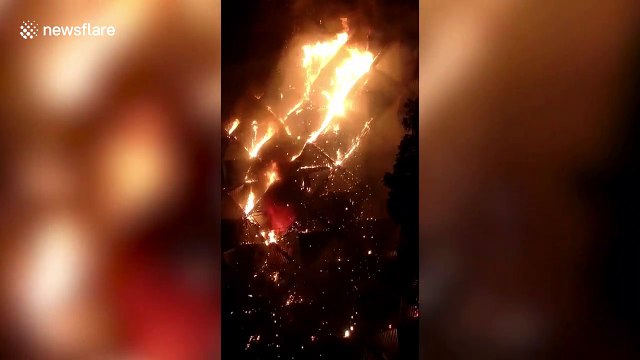 Multi-storey textile building engulfed in burning inferno as more than 50 fire engines rush to control situation in western India