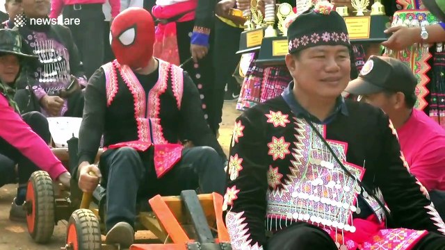 Mountain tribes race against each other in handmade wooden go-karts in Thailand