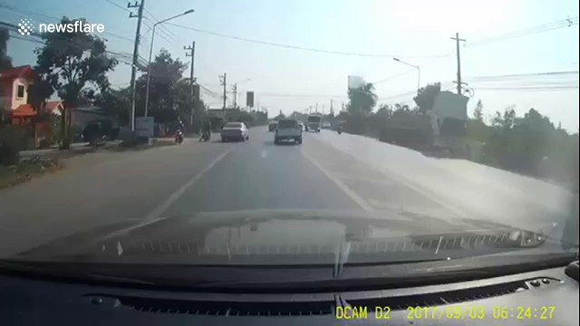 Overtaking truck topples over and crashes into oncoming pickup truck in Thailand
