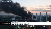 Iraqi security forces and anti-government protesters clash in Baghdad