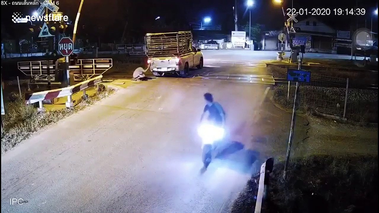 Thai driver stuck on level crossing battles to...