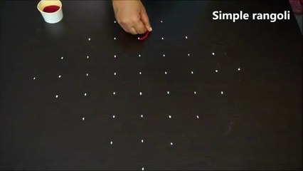 Beautiful rangoli design with colours   muggulu rangoli with 9x1 dots   Simple Rangoli designs