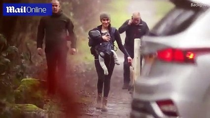 Smiling Meghan Markle takes Archie and dogs for a walk in the woods