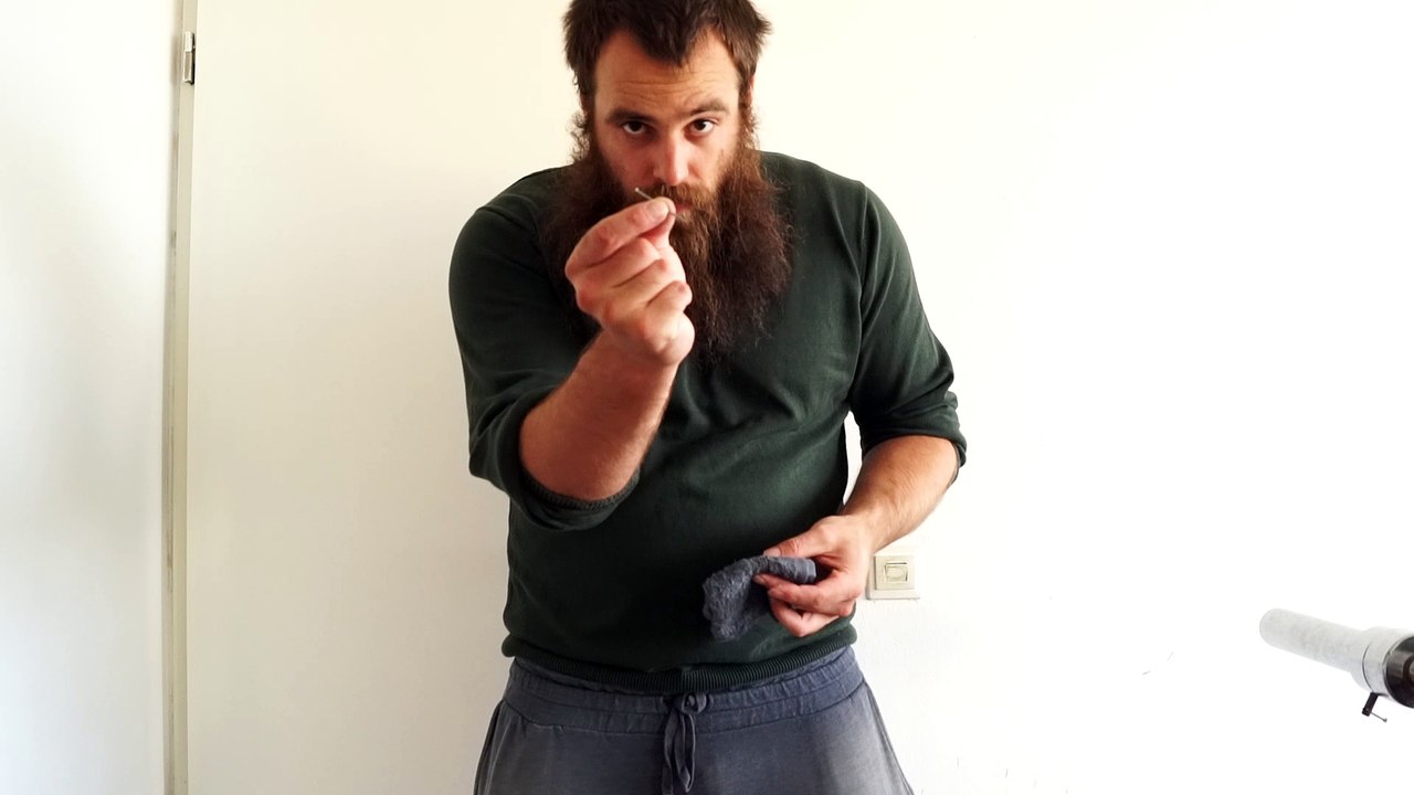 Old time strongman Bending a 2,4 x 45 mm iron nail