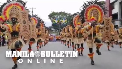 Illonggos wearing colorful costume of tribes dance on the streets of Iloilo City