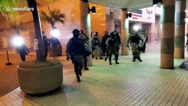 Coronavirus: Hong Kong police charge residents after protest against secret quarantine facility