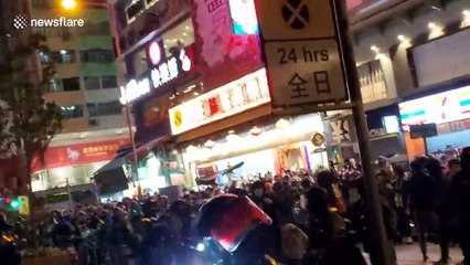 Tension in Hong Kong as riot police make arrests storming street food market
