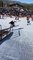 Snowboarder Collides into Skier After Jump Attempt Over Rail