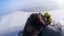 Men who fall through ice into freezing lake are filmed fighting for their lives