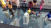 Tourists enjoy stunning view from 1,000ft high glass skywalk in Bangkok