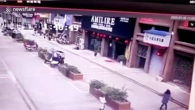 Manhole explosion sends four people flying into air after woman throws fireworks down it