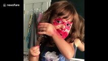 Young girl tries being beauty influencer by COVERING her face in lipstick