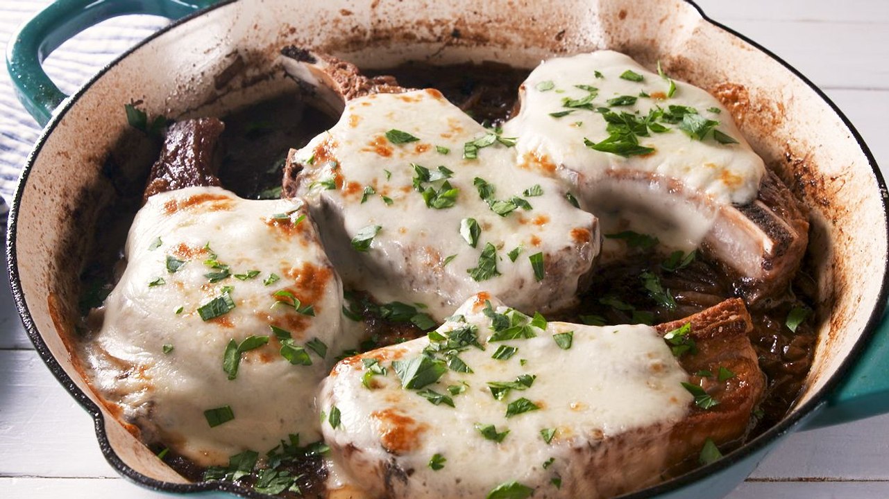 These French Onion Pork Chops Are Saucy, Cheesy, And Ridiculously Delicious