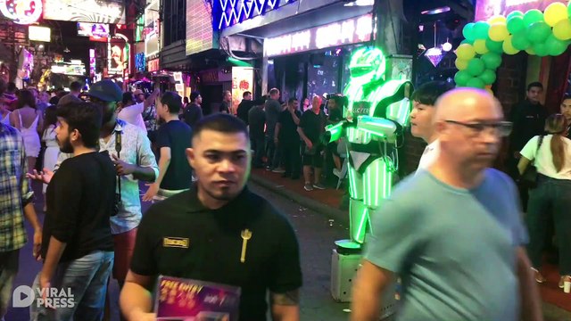 Illuminated Robots Welcomes Guests To Nightclub