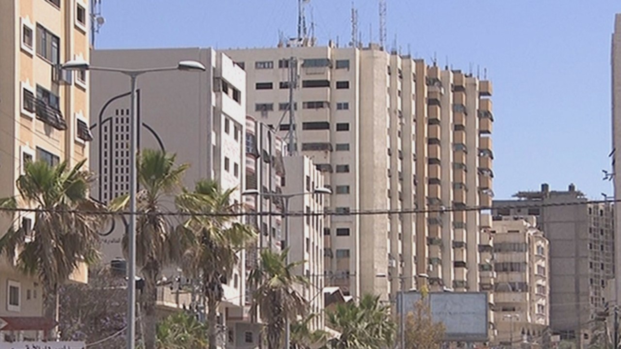 Dozens of Palestinian families evacuate tower block under threat