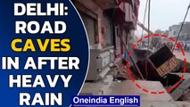 Delhi: Road caves in Najafgarh area after heavy rains, watch | Oneindia News