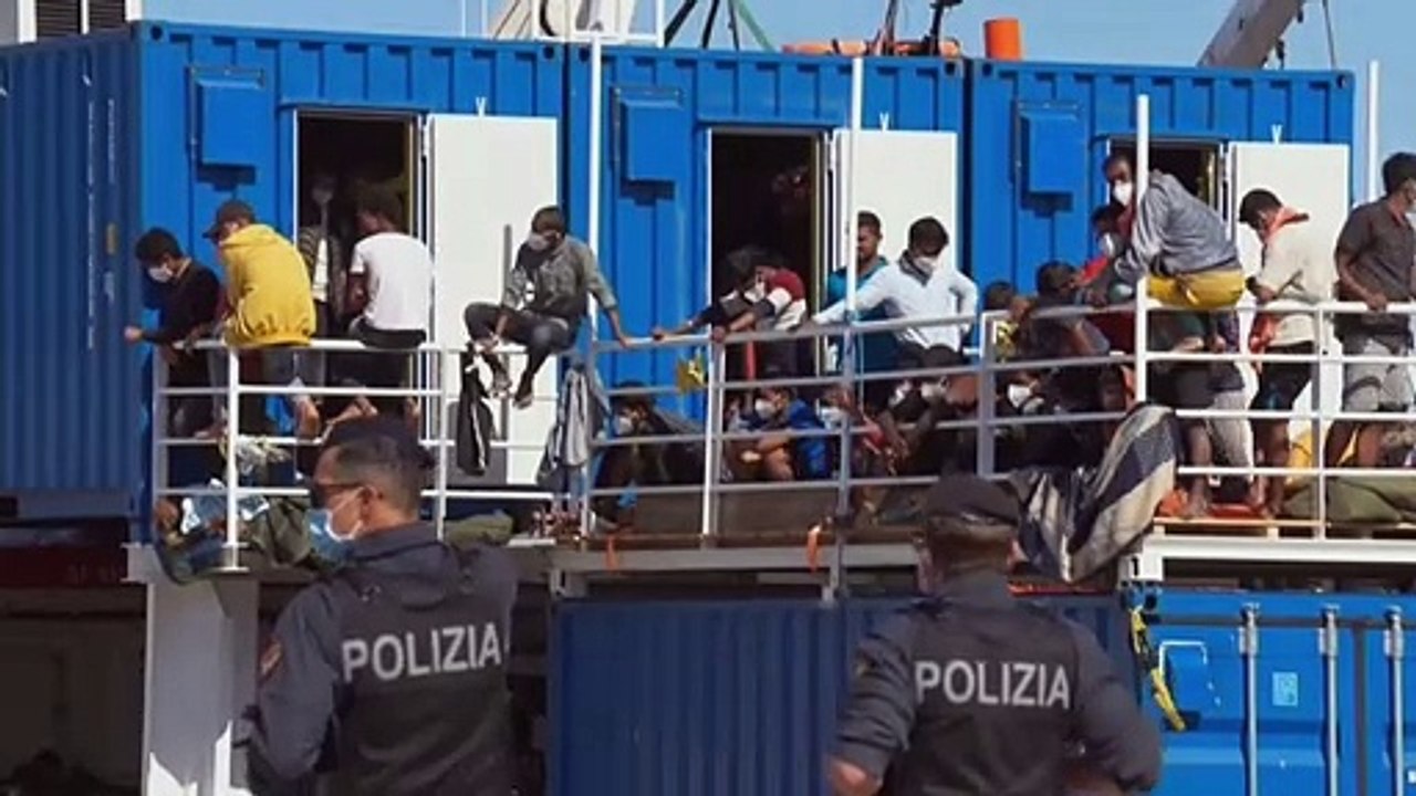 Hundreds of rescued migrants disembark from NGO ship in Sicily