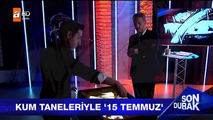 Darbe girişimini kumlarla resmetti