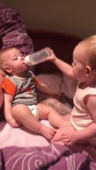 100% Funny Toddler hilariously attempts to bottle feed baby brother 2021