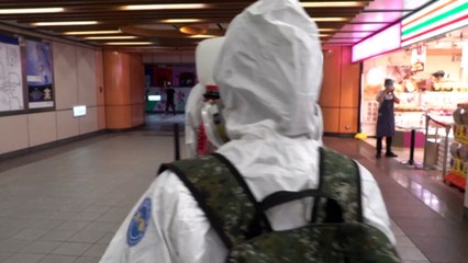 Taiwan extends lockdown, as soldiers disinfect metro and businesses shutter