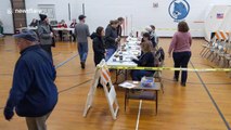 Democrat voters arrive at New Hampshire polling station ahead of primary election