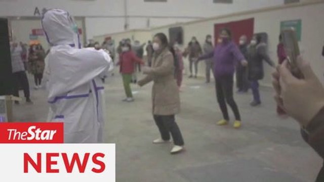 Coronavirus patients, medical staff dance at Wuhan hospital to stay positive