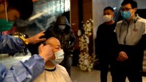 Nurses in Wuhan cut hair to fight against coronavirus outbreak