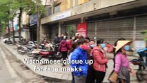 Vietnamese line up to buy face masks amid virus concern