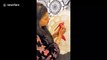 World record-holding henna artist decorates heels in beautiful design