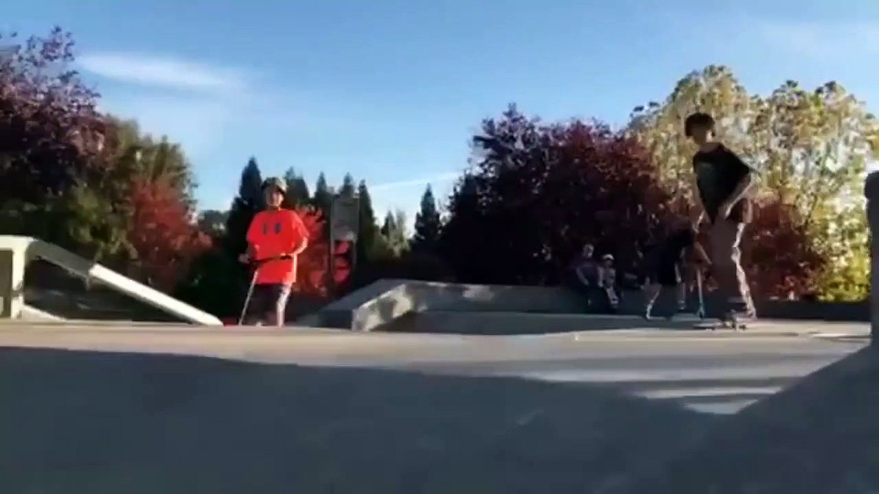 Skateboarder Ollies Down A Ramp And Falls On His Back