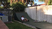 Skateboarder On Half Pipe Does A Trick And Fails