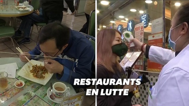 Contre le coronavirus, des restaurants de Hong Kong font manger leurs clients derrière une vitre