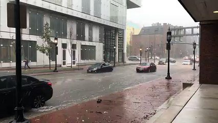 Man Uses Cup to Remove Water From His Waterlogged Car on Flooded Street