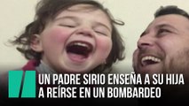 Un padre sirio enseña a su hija a reírse ante cada bombardeo