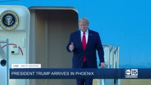 President Donald Trump walks off Air Force One at Phoenix Sky Harbor Airport