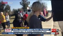 Several community members protest the President