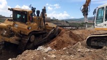 Cat D9T Dozer Pushing Huge Concrete Blocks