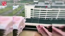 Umutsuz Wuhanlılar paralarını uçak yapıp camdan attı