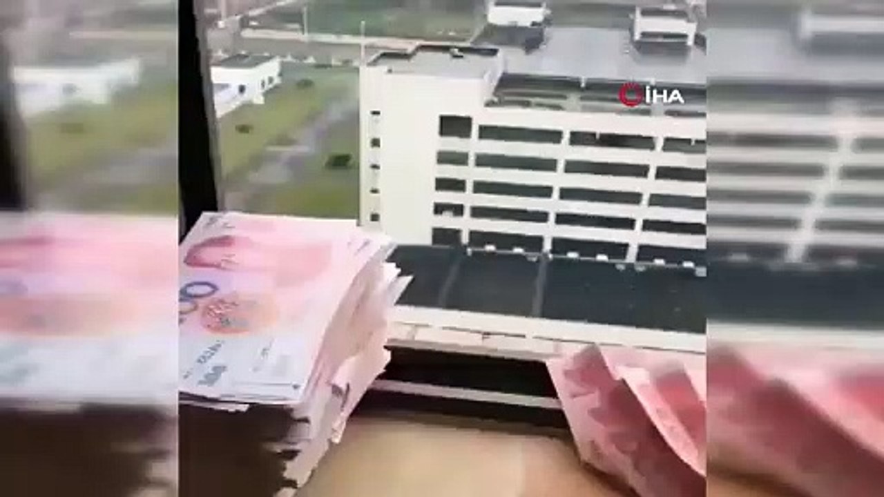 Umutsuz Wuhanlılar paralarını uçak yapıp camdan attı